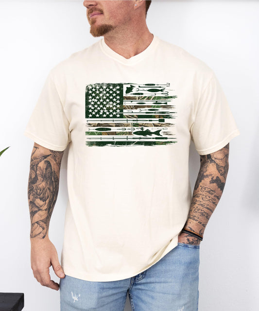 Front view of patriotic fishing graphic tee on model, ivory shirt with American flag and fishing lure print