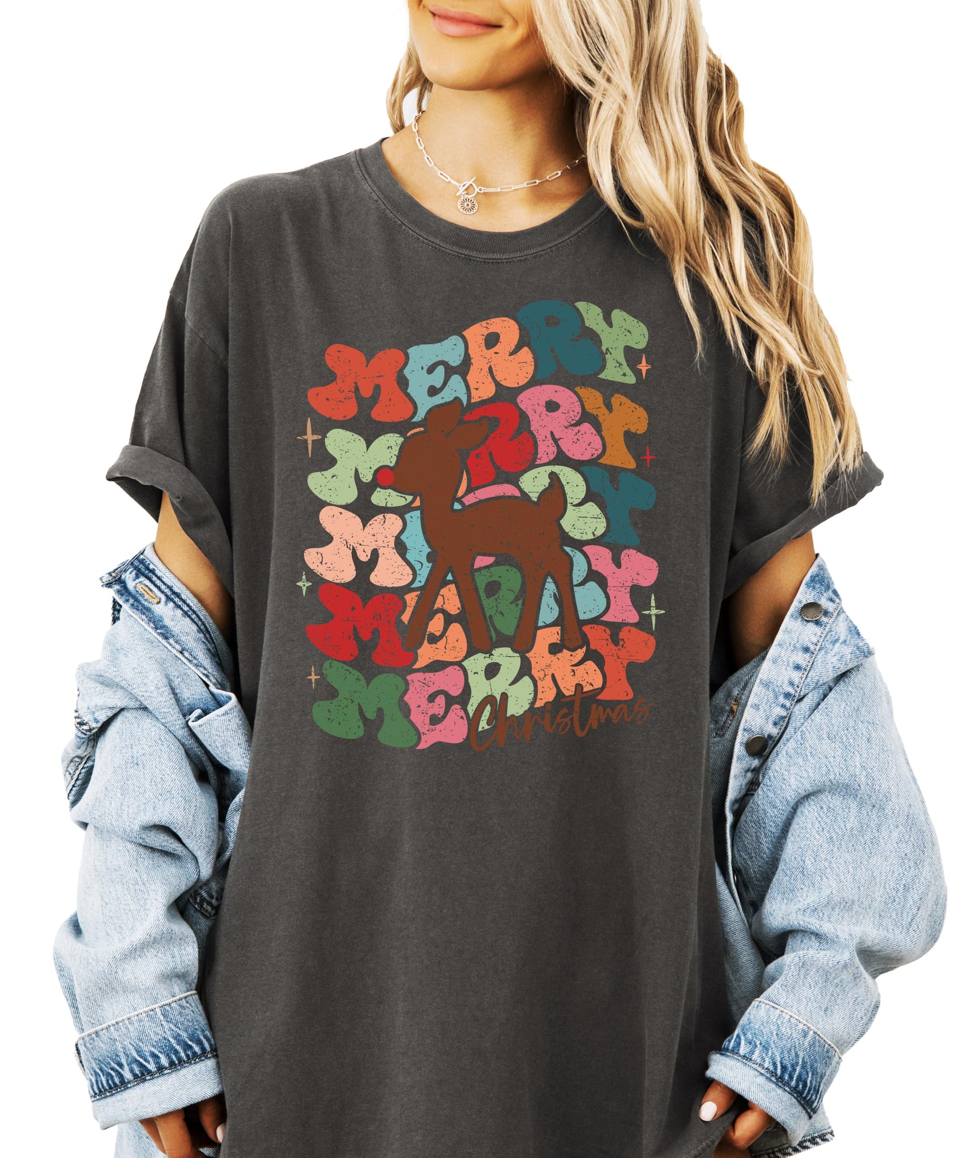 Close-up of vintage-inspired Merry Christmas reindeer print on women's holiday graphic tee
