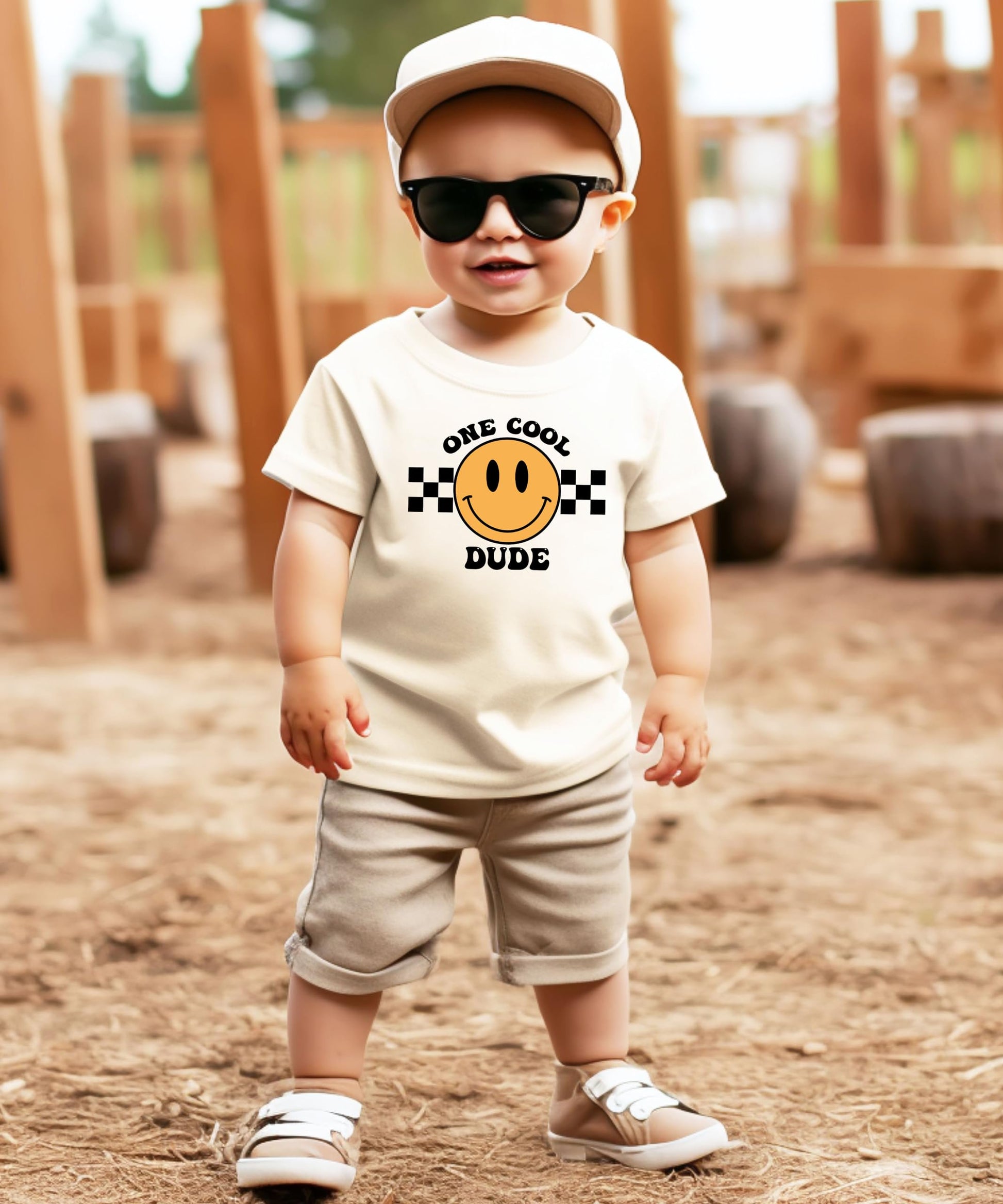 Detail shot of One Cool Mom 1st birthday shirt print on natural fabric