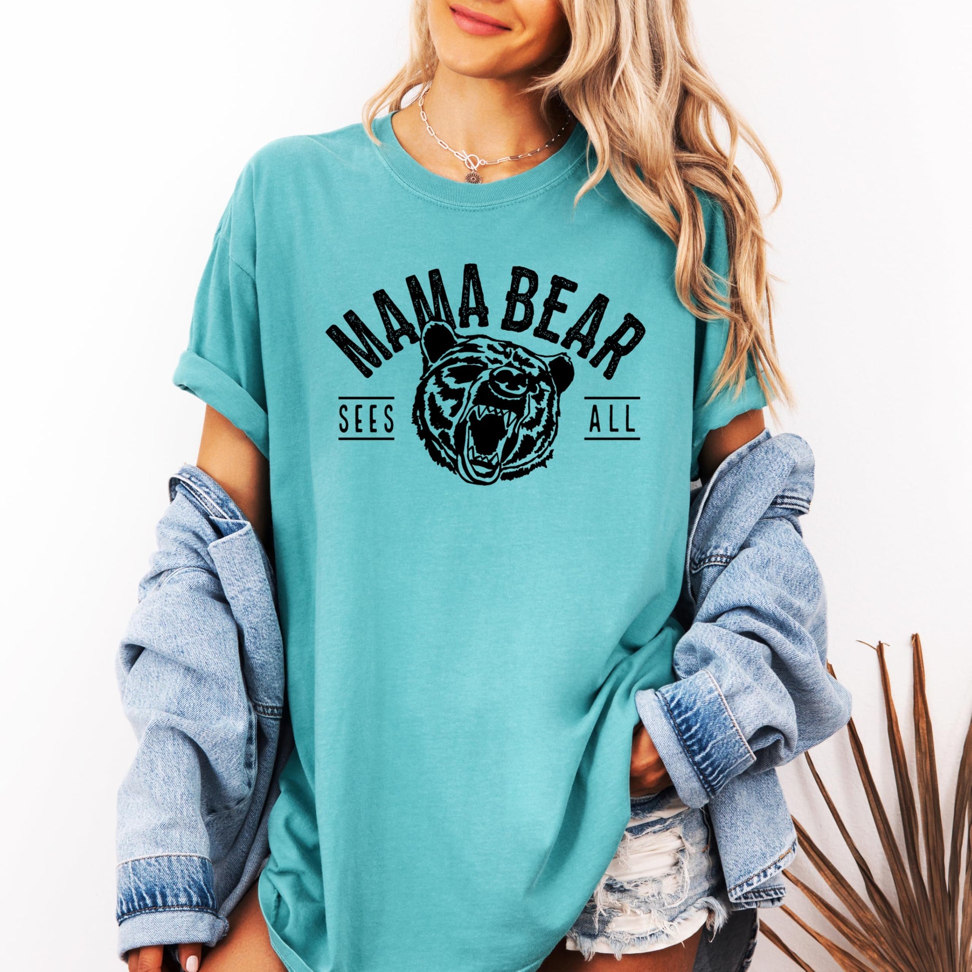 Lifestyle shot of Mama Bear Sees All funny women's graphic tee styled casually