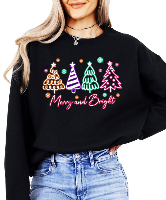 Women's black pullover sweatshirt with electric neon Christmas trees and Merry and Bright graphic print