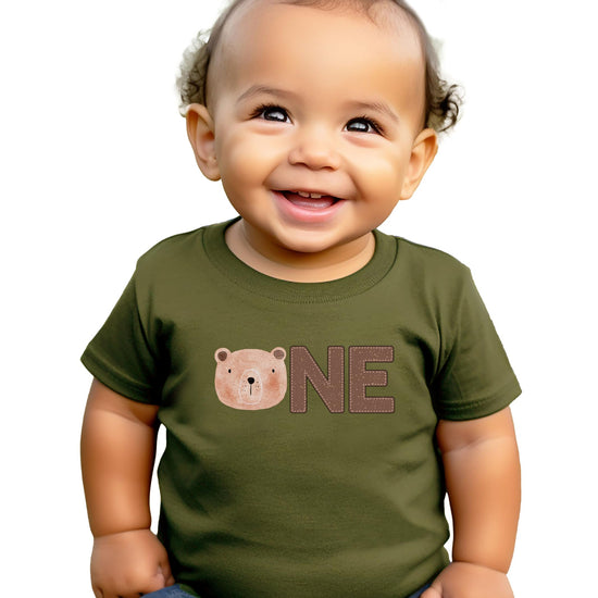 Flat lay of natural colored 1st birthday bear tee for baby boys
