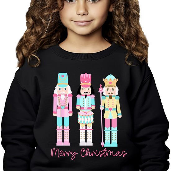 Festive black sweatshirt displaying colorful nutcracker graphic perfect for Christmas celebrations