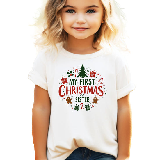 Dad holding newborn both wearing My First Christmas matching family holiday shirts