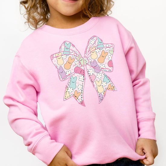 Side view of soft pastel pullover sweatshirt with Easter holiday graphic for girls