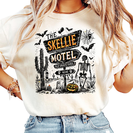 Model wearing Skellie Motel unisex Halloween graphic tee in seafoam, relaxed casual fit