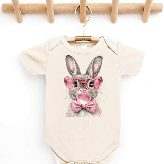 Natural bodysuit with spring Easter bunny graphic displayed for newborn and infant sizing reference