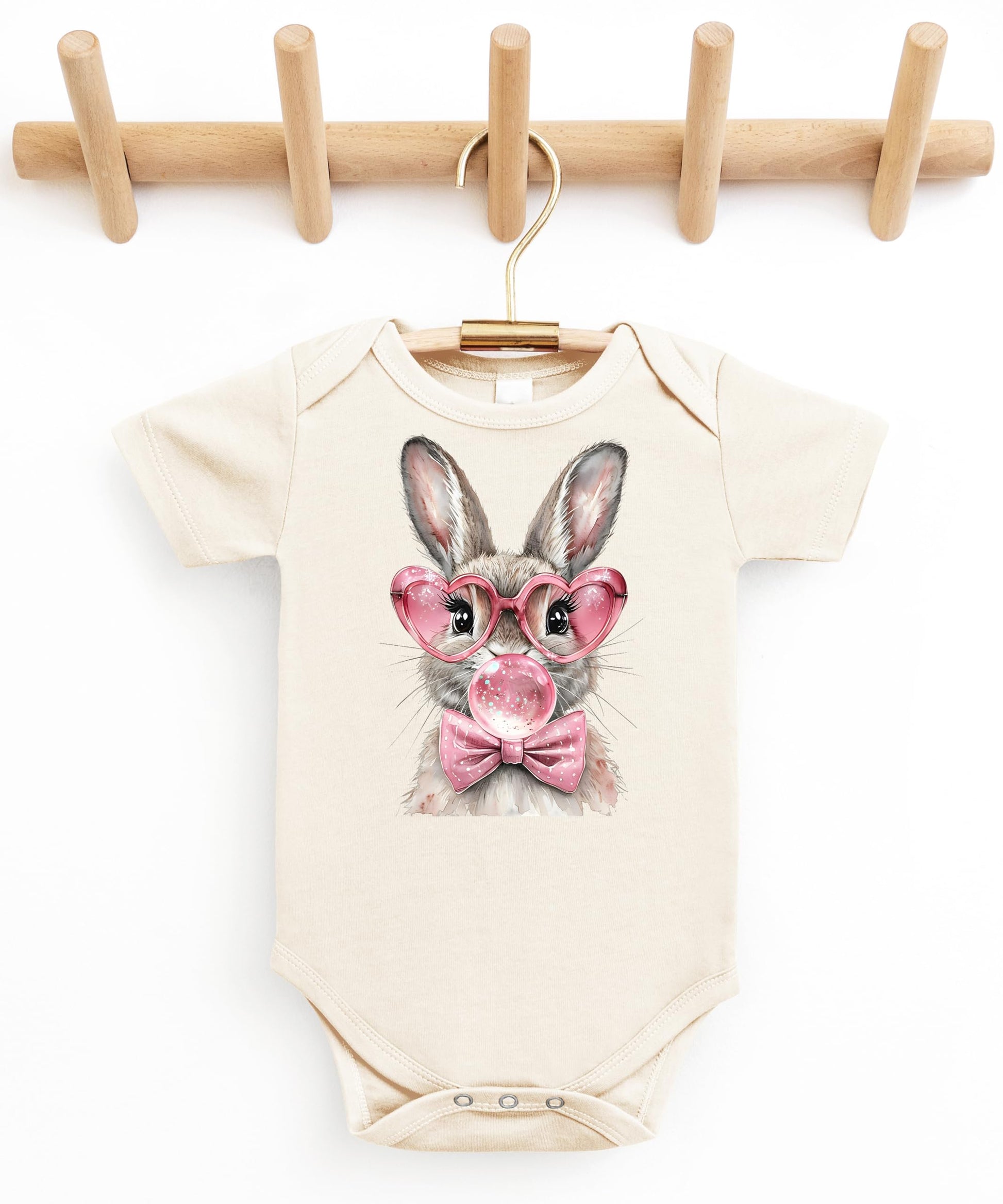 Natural bodysuit with spring Easter bunny graphic displayed for newborn and infant sizing reference
