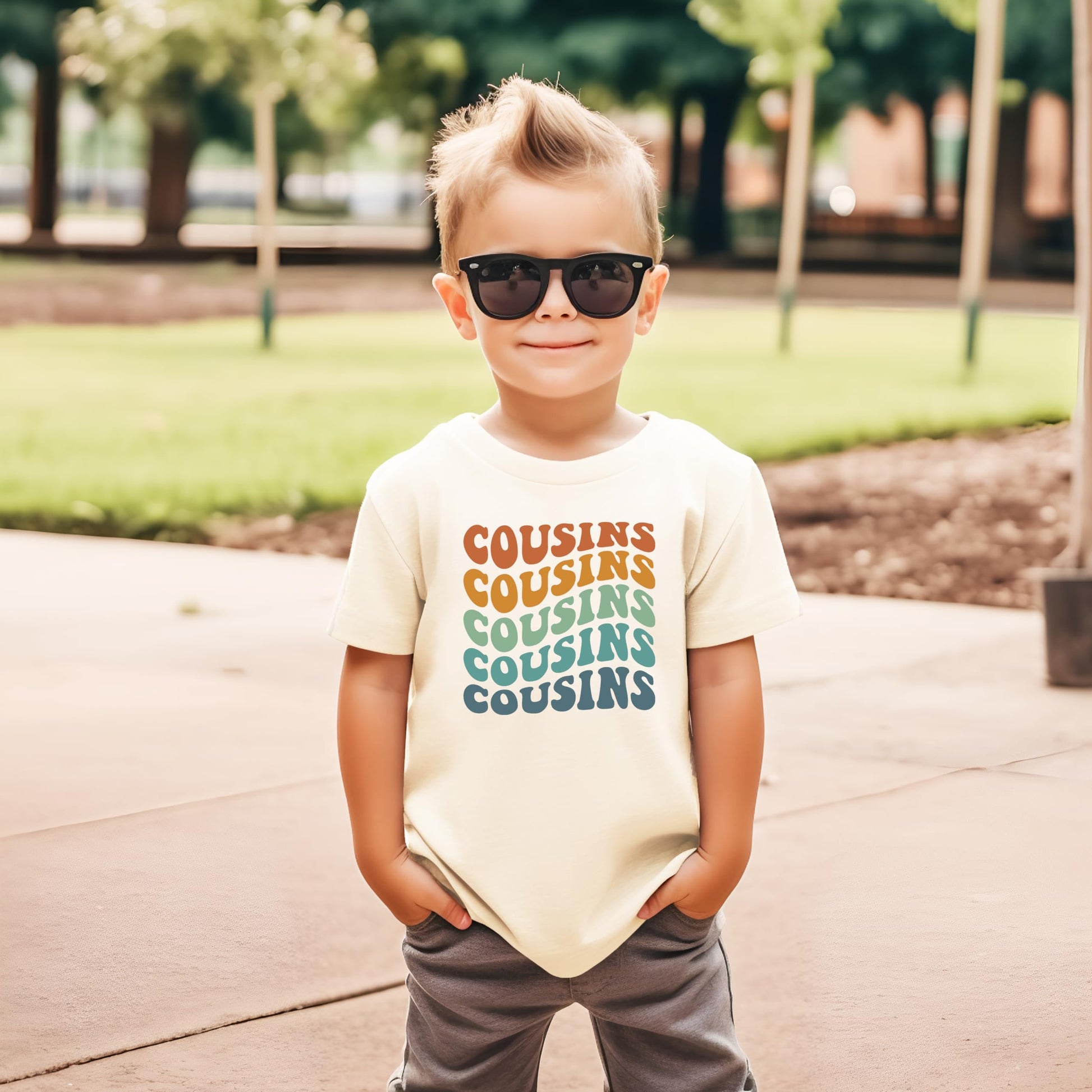 Kids wearing matching cousins wavy groovy retro shirts in family photo setup