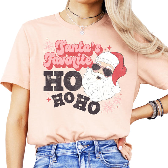 Front view of women's vintage red Ho Ho Ho Christmas shirt with retro Santa wearing sunglasses graphic
