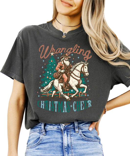Western Christmas tee with Santa riding horse graphic on ivory shirt