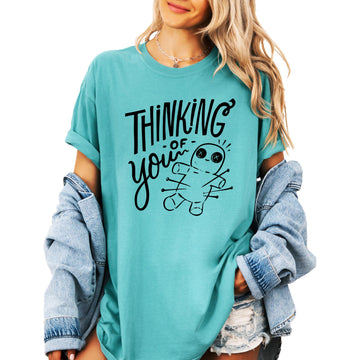 Black voodoo doll shirt with Thinking of You text and pin graphic for women