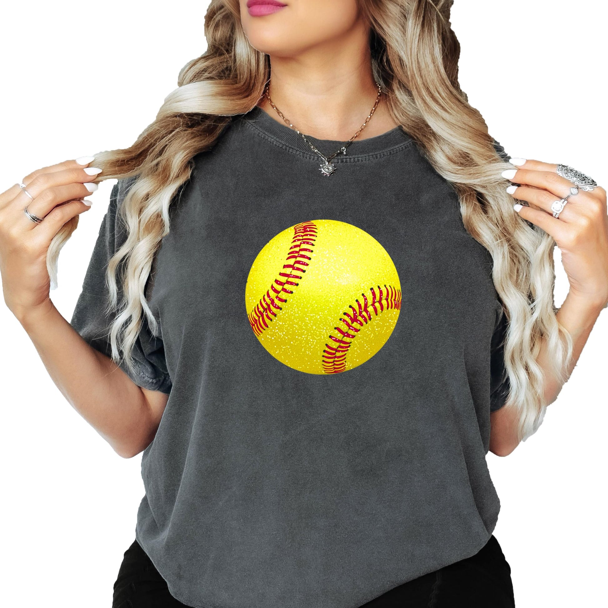 Close-up of faux glitter yellow softball print on ivory graphic tee for women