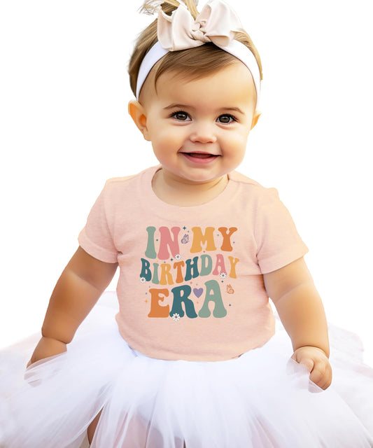 Kids 'In My Birthday Era' peach graphic tee with trendy wavy lettering design for girls