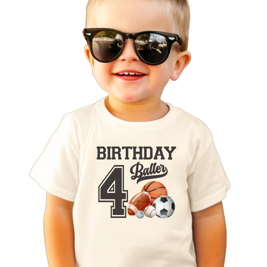 Flat lay of boys birthday baller t-shirt showing full graphic design and heather fabric texture