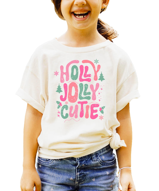 Front view of pink festive Christmas shirt for girls with colorful holiday graphic design