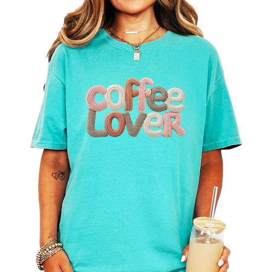 Side view of women's ivory coffee lover graphic tee showing fit and style