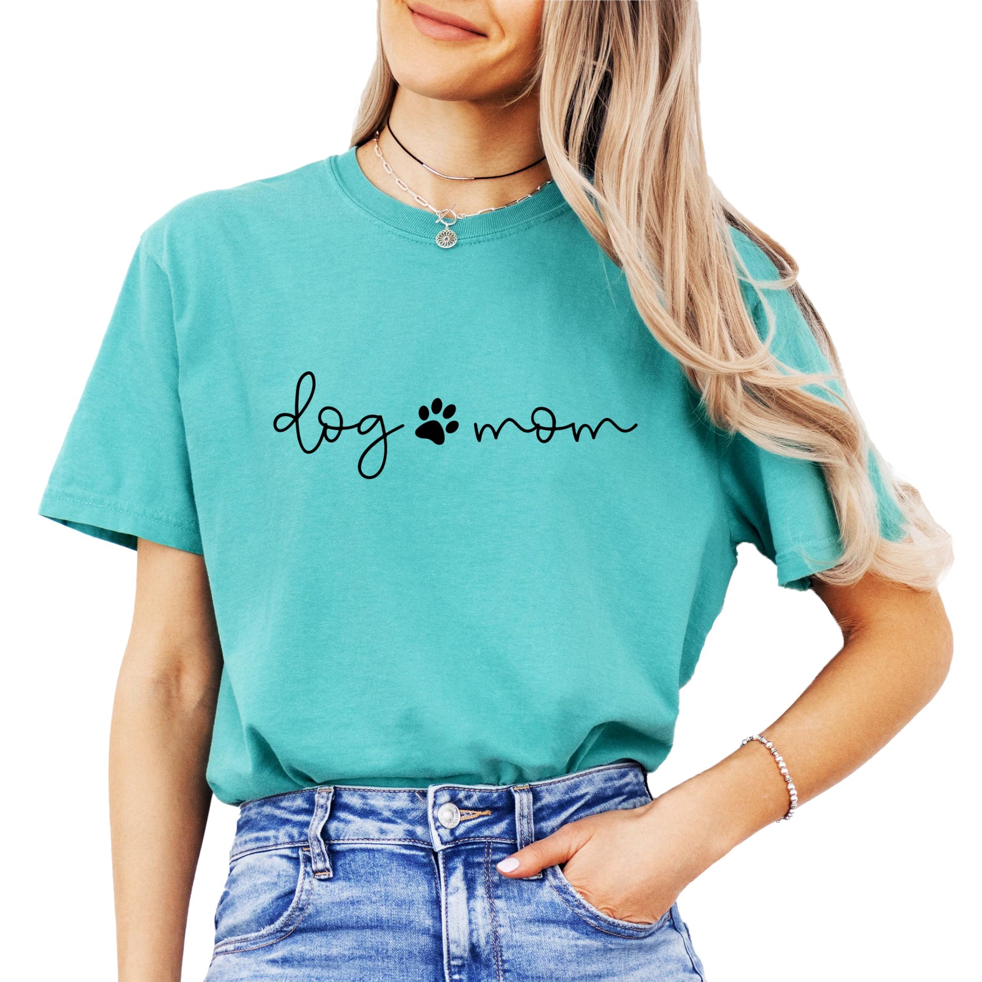 Front view of Dog Mom women's t-shirt in seafoam with paw print graphic detail