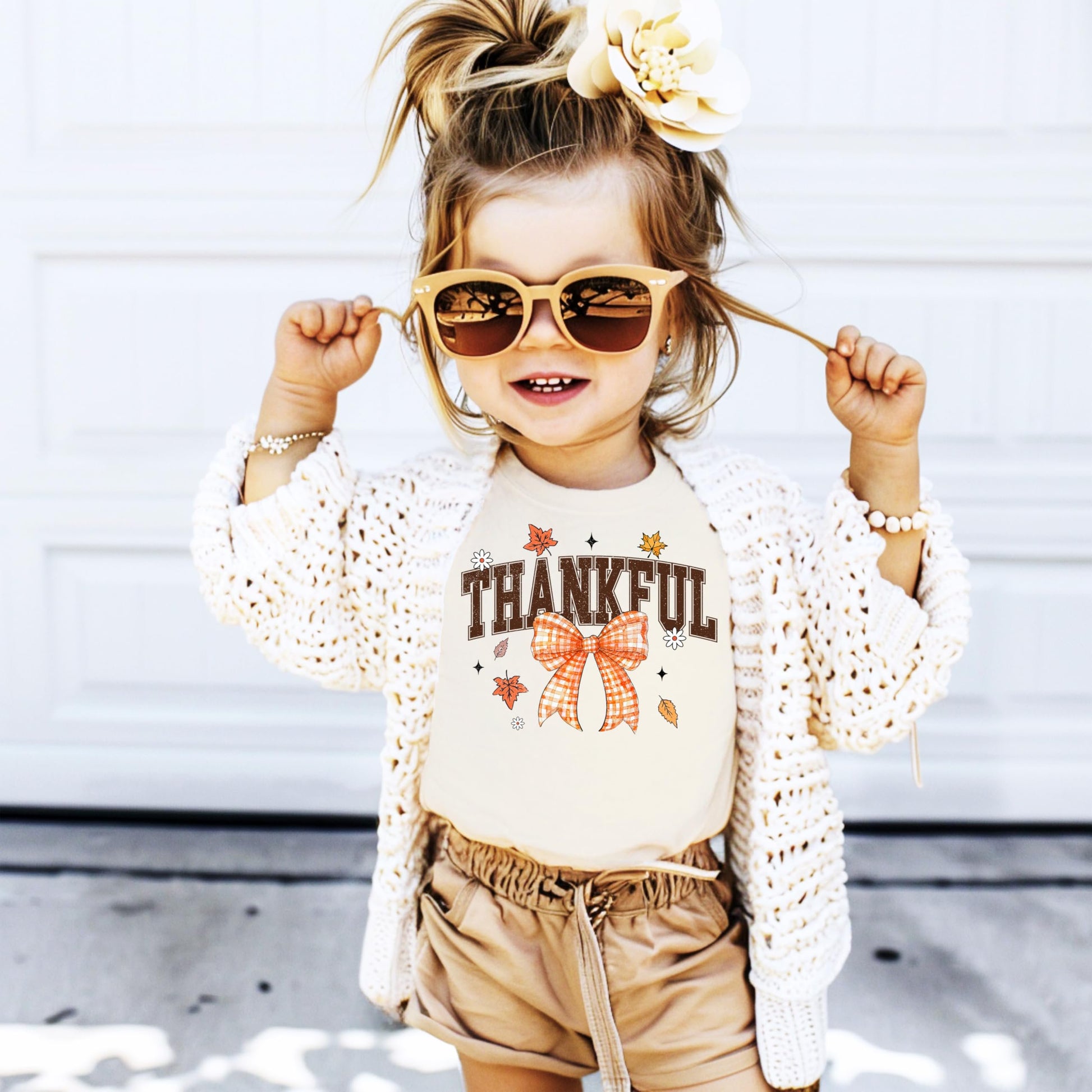 Fall Thanksgiving shirt styled on model showing fit and orange bow design