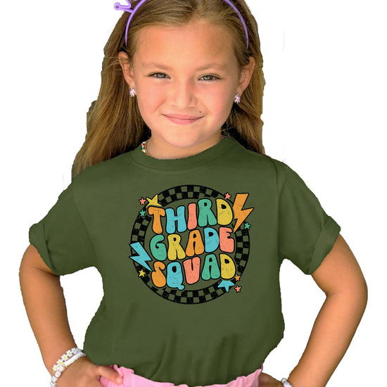 Close-up of retro groovy lightning squad graphic on kids back to school natural shirt
