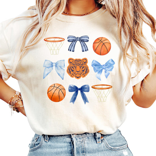 Detail shot of Tigers mascot bow and basketball hoop graphic on women's shirt