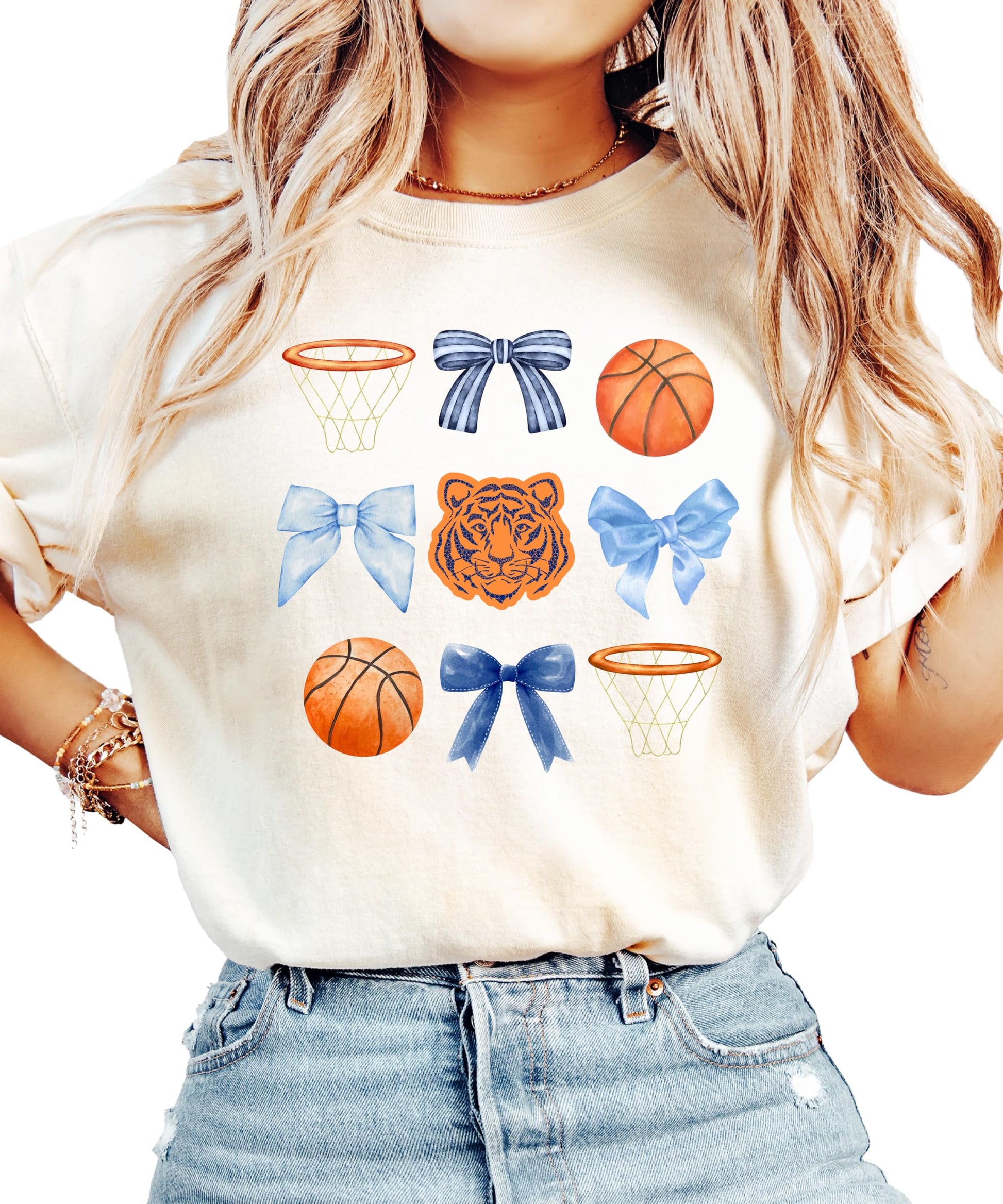 Detail shot of Tigers mascot bow and basketball hoop graphic on women's shirt