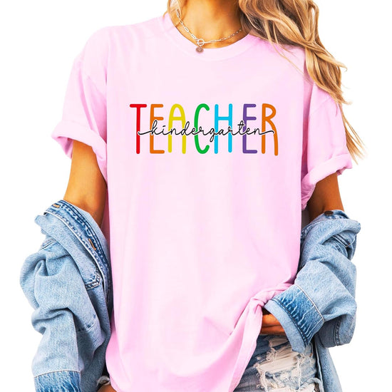 Kindergarten teacher shirt styled with jeans — colorful rainbow graphic tee for women