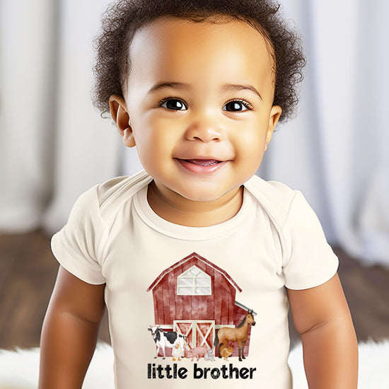 Close-up of farm animals barn graphic print on Little Brother baby bodysuit