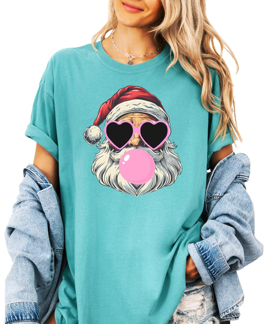 Seafoam green Santa bubble gum Christmas shirt with pink heart sunglasses design laid flat