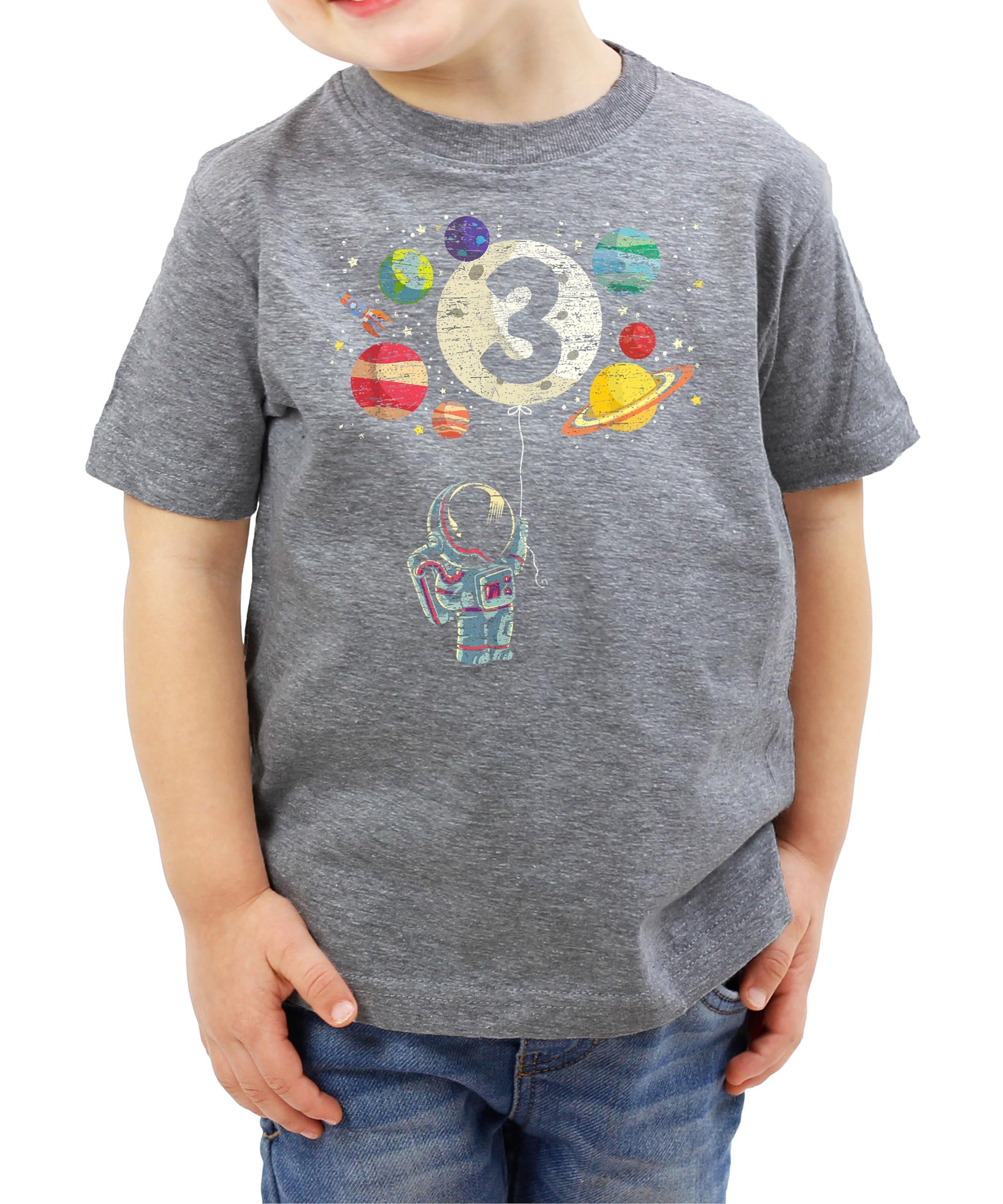 Flat lay of black kids birthday tee with astronaut rocket and moon balloon graphic