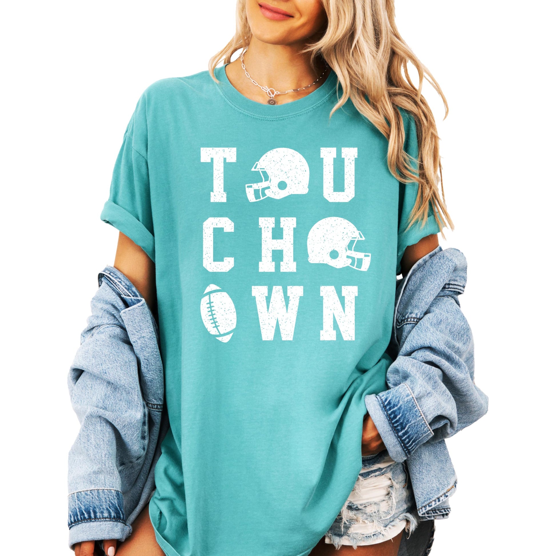 Side view of woman modeling ivory football season shirt with distressed graphics