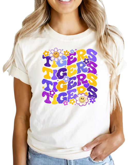 Close-up of Purple Tigers graphic design showing purple retro lettering with decorative flowers