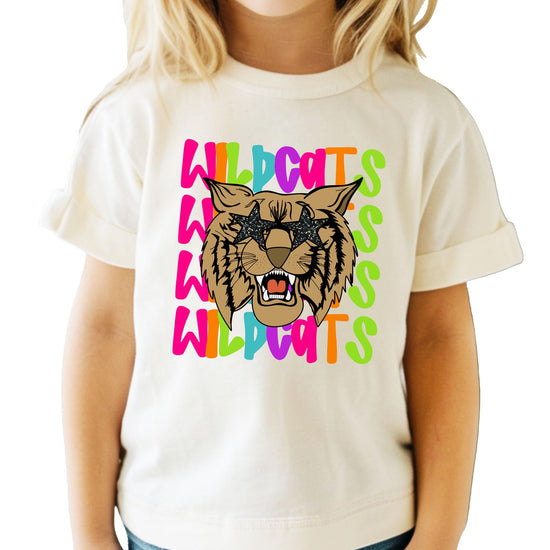 Close-up of wildcats mascot design showing glittery star sunglasses and vibrant text