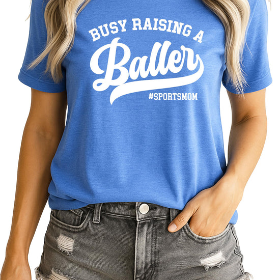 Busy Raising a Baller funny sports mom graphic t-shirt in black