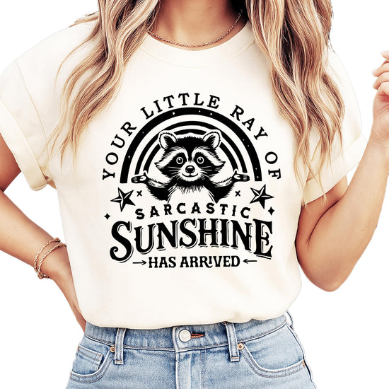 Close-up view of raccoon graphic design with Your Little Ray of Sarcastic Sunshine text