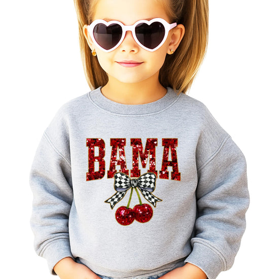 Teen wearing Alabama BAMA graphic crewneck sweatshirt in white with bold red sequin-style lettering