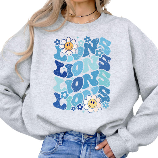 Model wearing gray Lions blue retro graphic sweatshirt casual styling