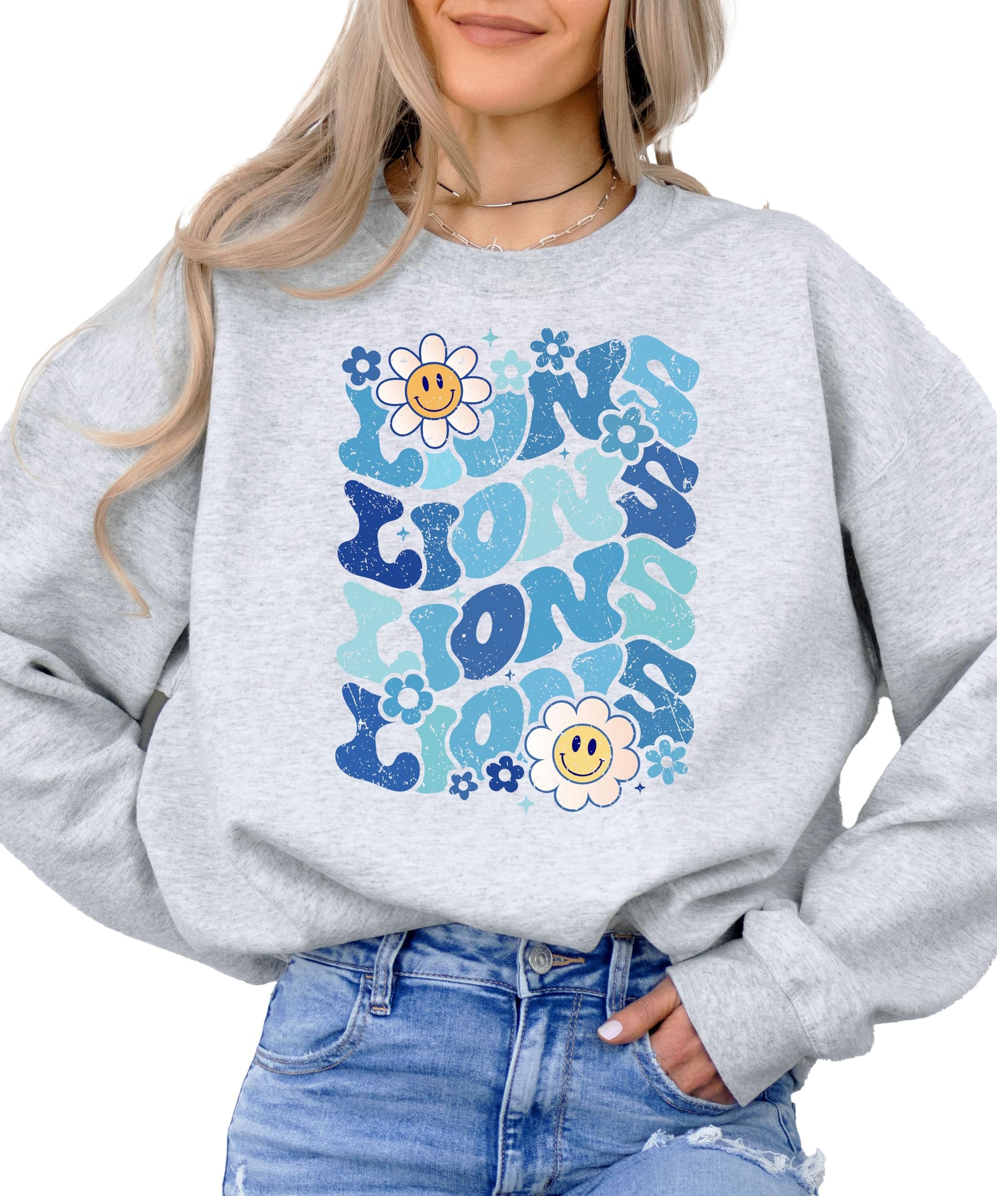 Model wearing gray Lions blue retro graphic sweatshirt casual styling