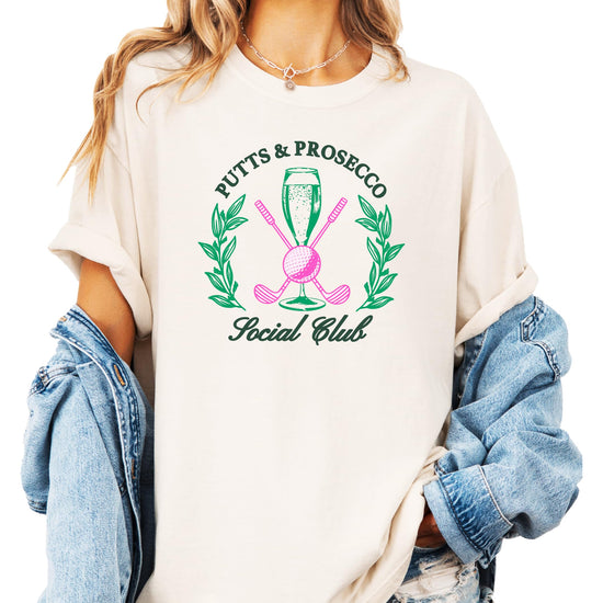 Women's ivory golf graphic t-shirt with Putts and Pros Social Club print, front view