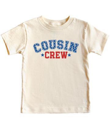 Flat lay of natural kids t-shirt showing full USA Cousin Crew patriotic design