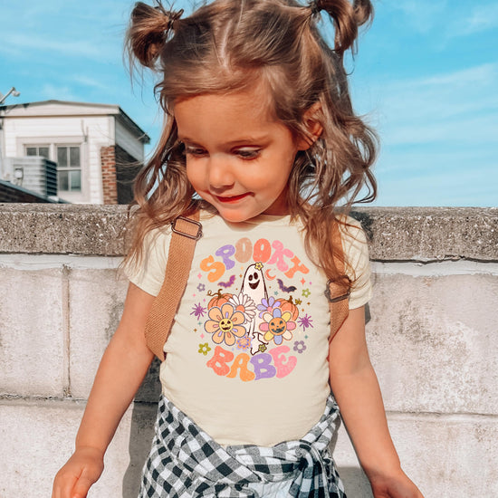 Toddler girl wearing Spooky Babe ghost Halloween tee, front view