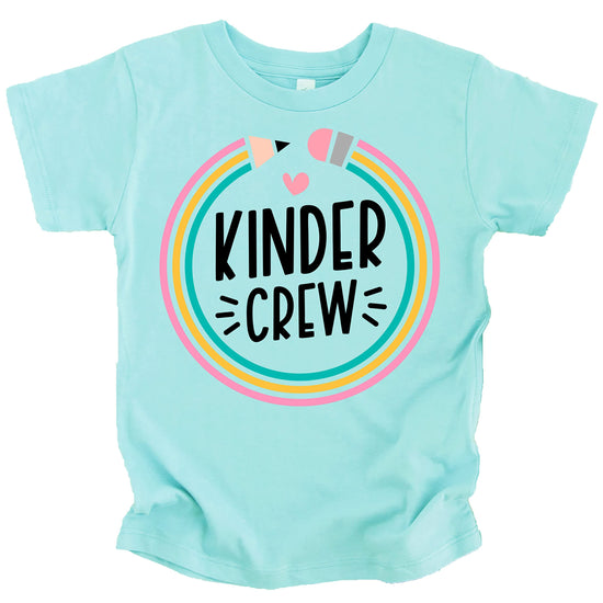 Flat lay of pink youth Kindergarten Crew 1st day of school graphic tee