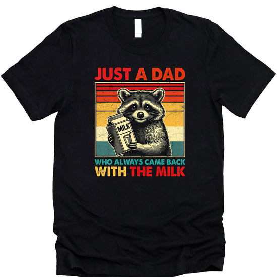 Flat lay of black funny dad graphic tee with Came Home With the Milk raccoon design