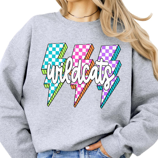 Close-up of lightning bolt graphics in teal, pink, and purple checkered patterns