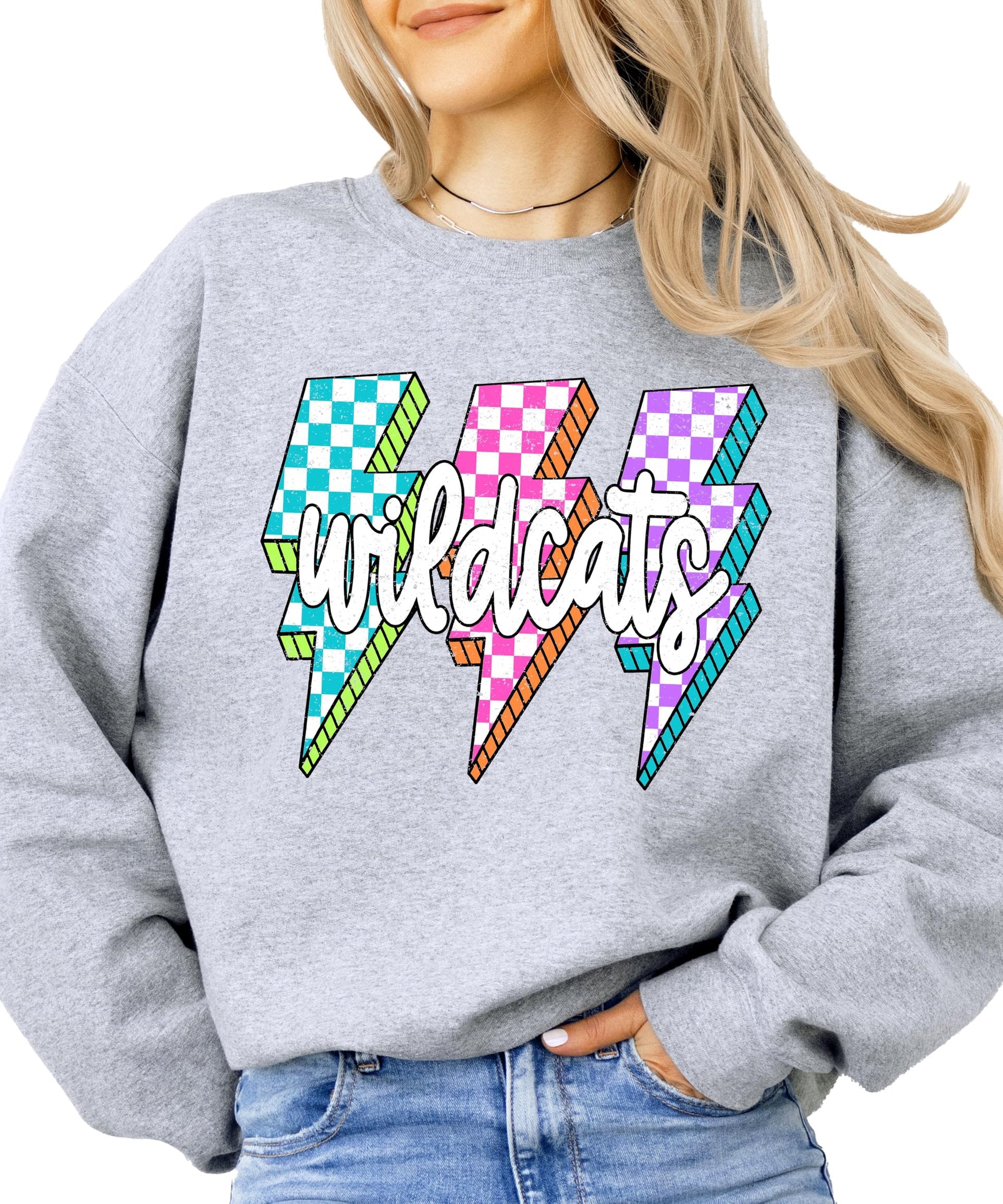 Close-up of lightning bolt graphics in teal, pink, and purple checkered patterns