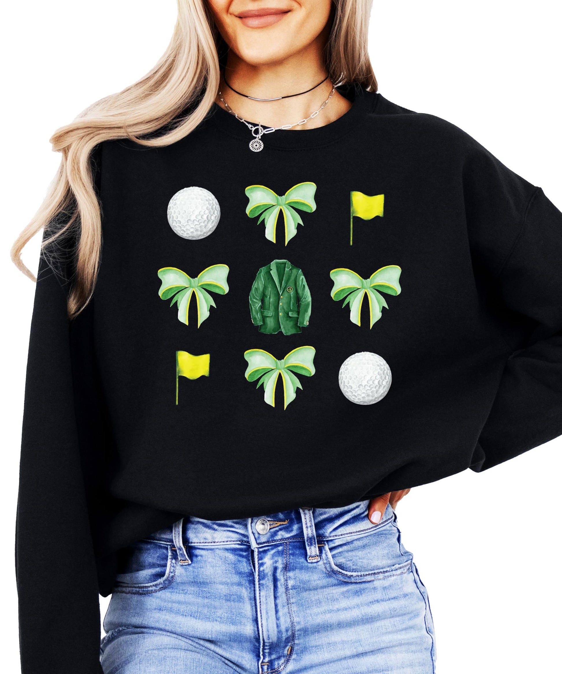 Close-up of green bows and golf balls graphic on white women's pullover sweatshirt
