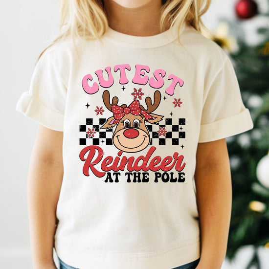 Close-up of cute reindeer graphic with festive details on girls' holiday t-shirt