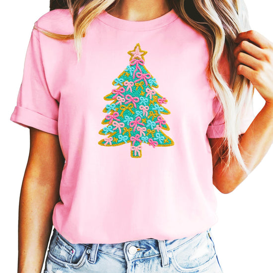 Full product flat lay of natural kids Christmas graphic tee with pink bow ornament tree design
