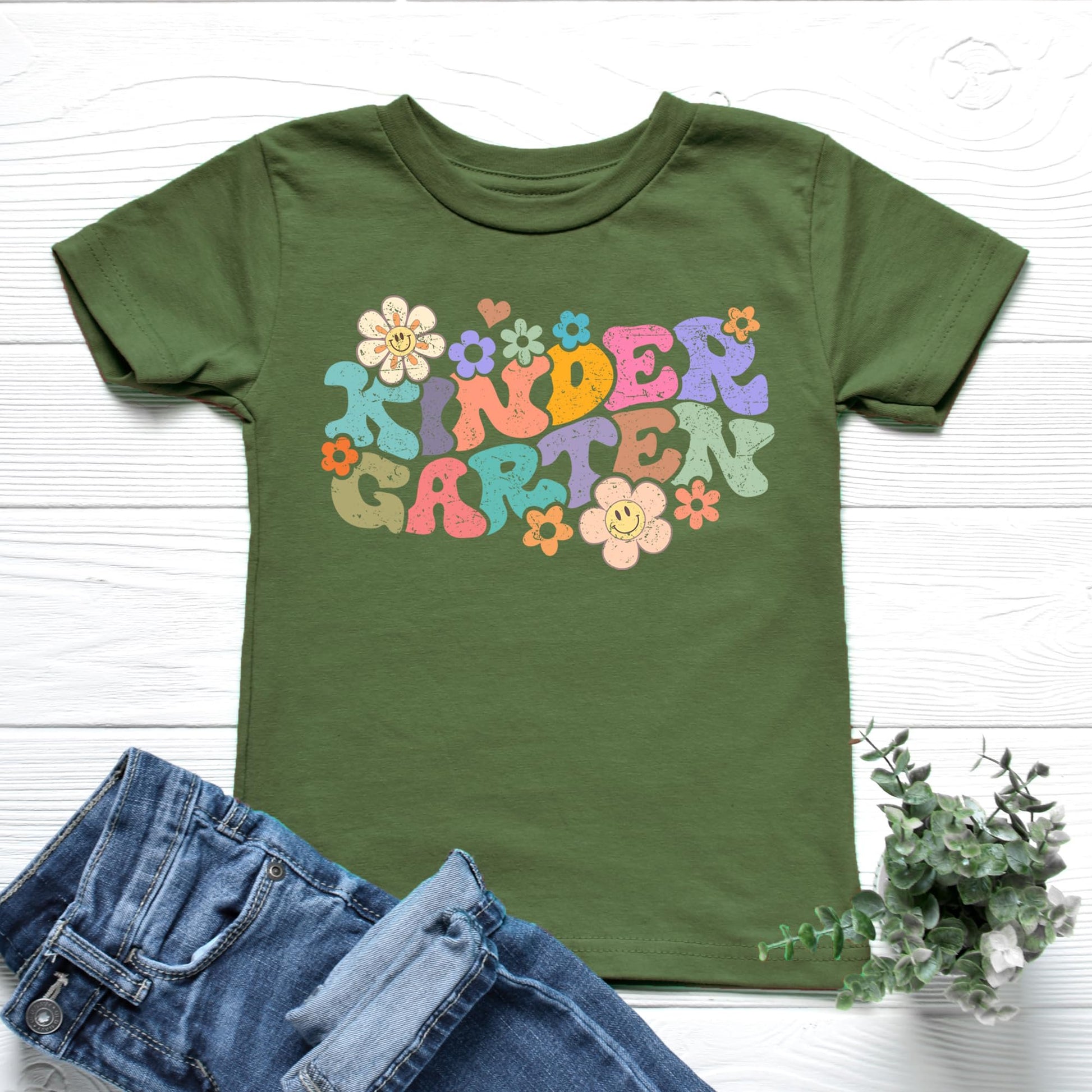 Back to school natural t-shirt with retro groovy daisy kindergarten design, product detail shot