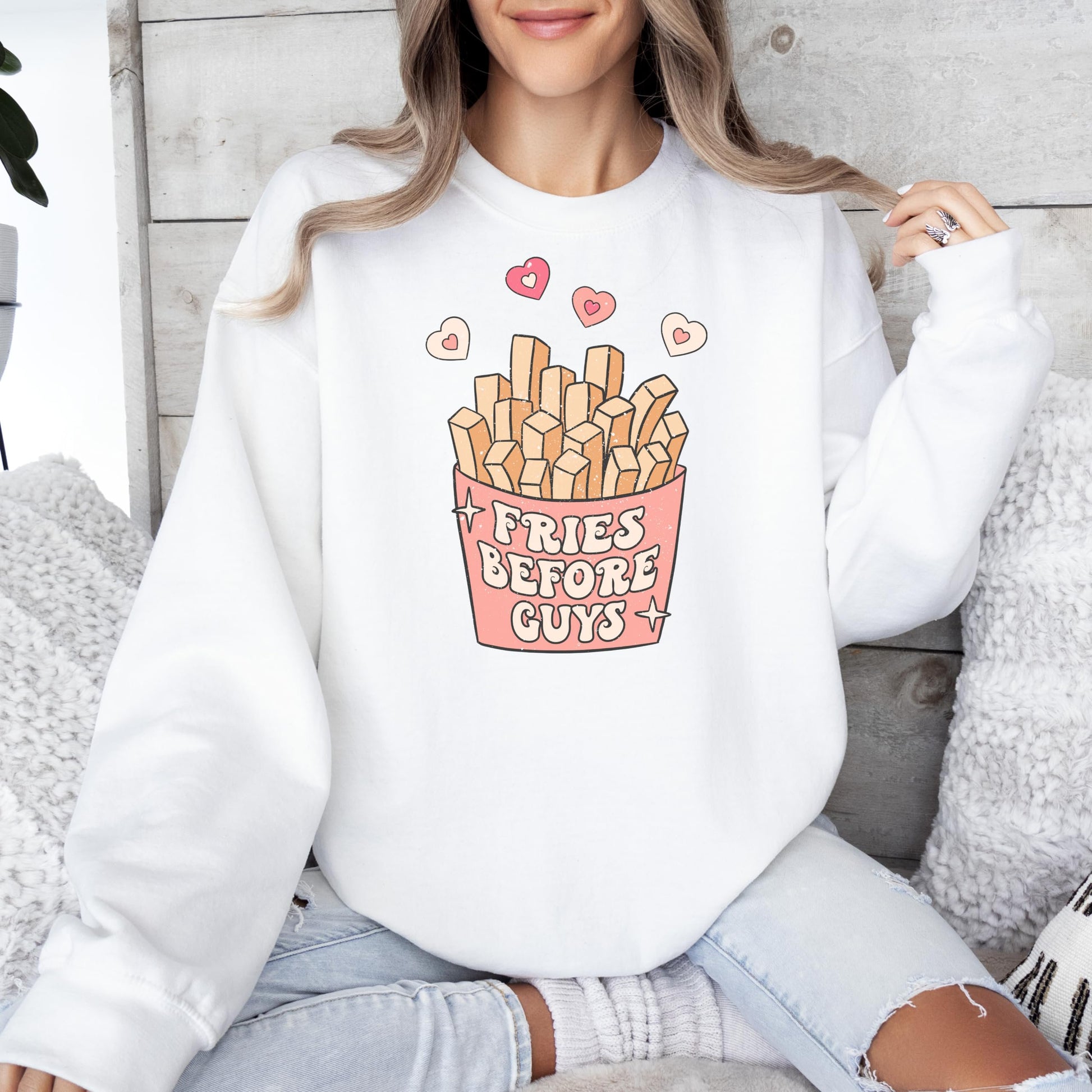 Close-up of Fries Before Guys graphic print detail on gray fleece sweatshirt